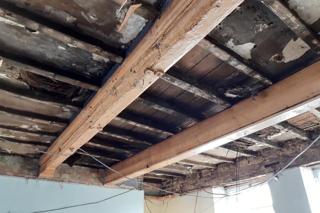 When Shane took down the false ceiling on part of the ground-floor, a rich history presented itself. Not only was there evidence of fire damage, but one beam (pictured in the foreground above) appears to have been reclaimed from a ship, with nautical detailing on show, but also salt damage. This is the part of the building that was formerly a confectioner's and, before that, a beerhouse - the Hope and Anchor.