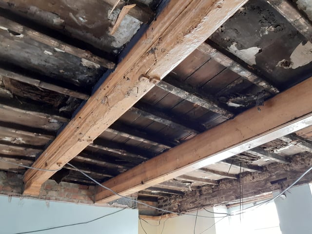 When Shane took down the false ceiling on part of the ground-floor, a rich history presented itself. Not only was there evidence of fire damage, but one beam (pictured in the foreground above) appears to have been reclaimed from a ship, with nautical detailing on show, but also salt damage. This is the part of the building that was formerly a confectioner's and, before that, a beerhouse - the Hope and Anchor.