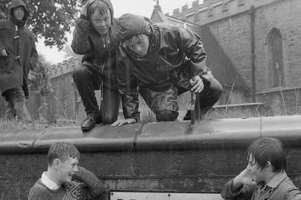 The flood was a source of entertainment for kids in the area