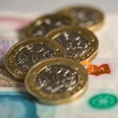 File photo dated 26/01/18 of a pile of pound coins on top of bank notes. The Pensions Regulator should be given a duty to consider the impact of the pensions sector on the wider financial system, according to the House of Lords' The Industry and Regulators Committee, which has criticised the use of leveraged liability-driven investment (LDI) strategies by defined benefit (DB) pension funds, which it said played a significant role in the financial turmoil following the mini-budget in September. Issue date: Tuesday February 7, 2023.