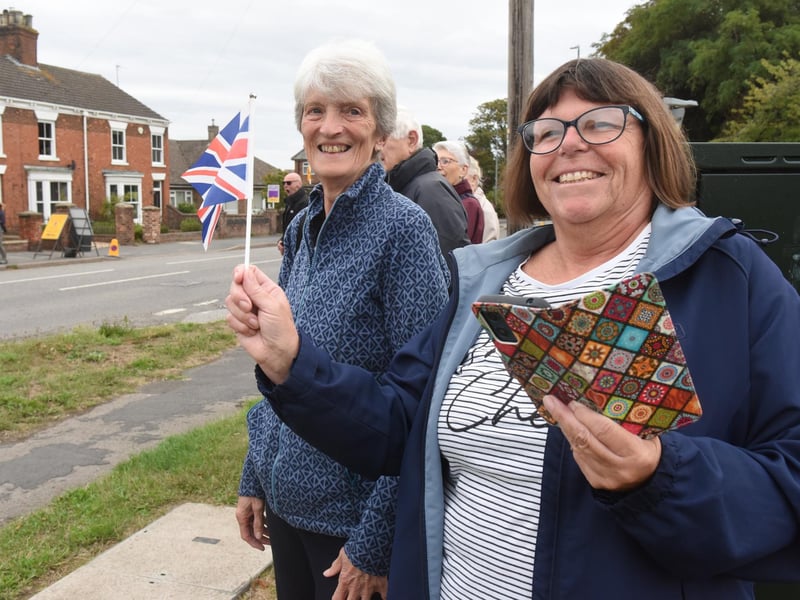 Waiting with flags and cameras in Market Rasen. L-R Janet Britton and Tracey Lane.