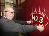 Mick Allen, who is doing much of the work on the carriage, with the ‘Queen Mary’ nameplates made by traditional signwriter Tim Fry . They t will be fitted for the 2023
season. (Photo © Chris Bates/LCLR).