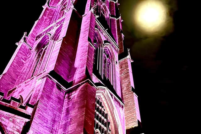 St James Church lit up in purple for polio. Photo: Paul Rudd, Louth.