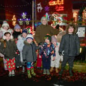 Elmtree Road home owner, Jacky Cooper with children and her lights. Photo: David Dawson