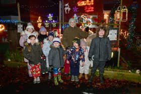 Elmtree Road home owner, Jacky Cooper with children and her lights. Photo: David Dawson