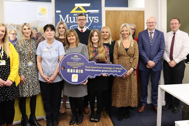 Mundys staff and representatives from Marie Curie, Lincolnshire