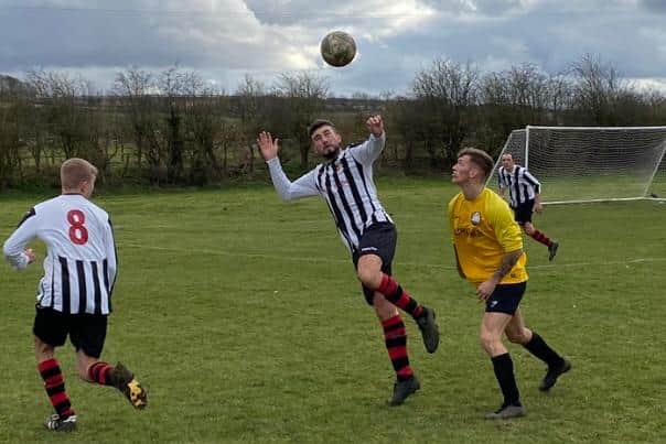 Action from Barnetby's win over Ashby Bowl.
