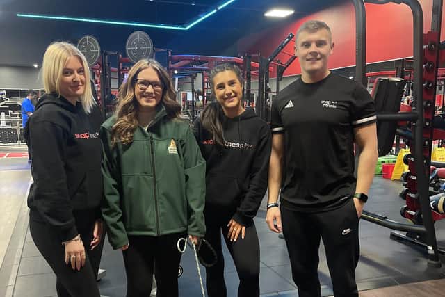 Jerry Green fundraiser Bethan, with dog Ralphie and the team at Snap Fitness in Gainsborough