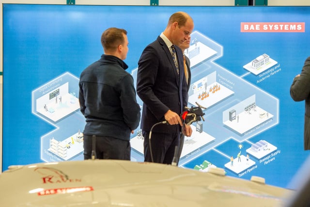 HRH The Prince of Wales tries out BAE System's digital inspection technology.