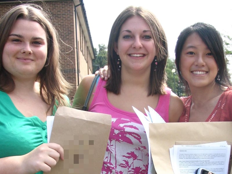 Three more Boston High School students pose for the camera in August 2006.