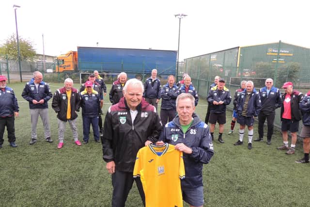 Mick Czopowyj with snails chairman Steve Spick and the Ukrainian shirt raffled off.