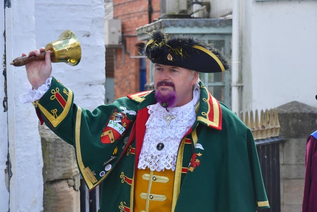 Sleaford Town Crier John Griffiths leads the parade to the market place.