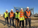 Representatives from the Council and its project board visited Sleaford Moor Enterprise Park to see progress onsite, including the first steels now up. Pictured from left: North Kesteven District Council Economy and Place Director Andy McDonough, Chief Executive Ian Fytche, Director of Resources Russell Stone, Deputy Council Leader Councillor Ian Carrington and Council Leader Councillor Richard Wright.