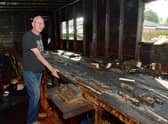 Sean Malone of Boston, shows us the devastating impact of the fire on his model railway collection and sentimental items from his family travels.