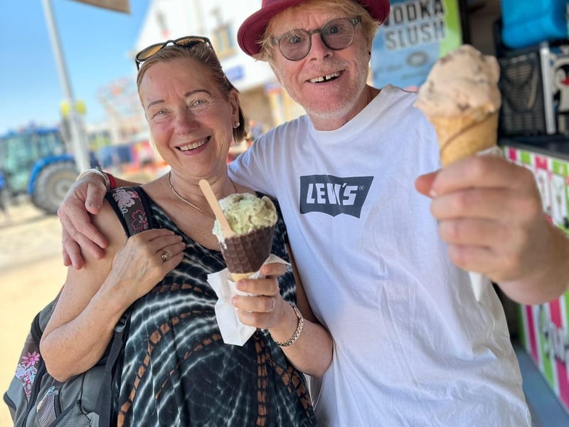 Ingrid Lohmann, Deputy Mayor of Bad Gandersheim, enjoying a Skegness ice-cream with local artist John Byford.
