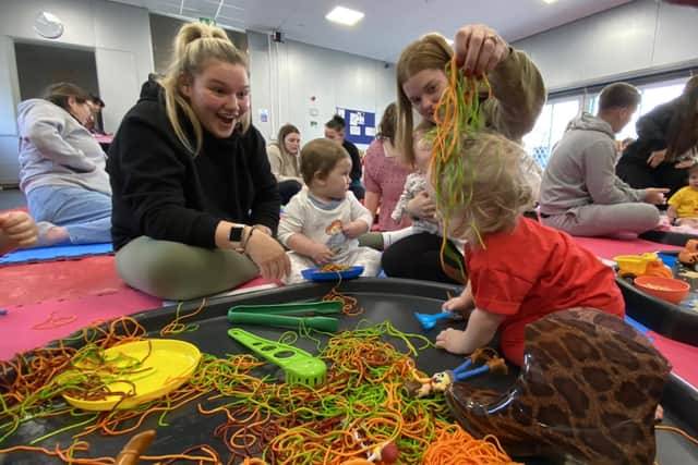 Families enjoying the messy play.