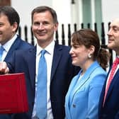 Finance Minister and MP for Louth and Horncastle Victoria Atkins (second right) with Chancellor James Hunt (centre) ahead of today's Budget..