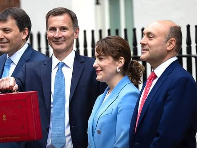 Finance Minister and MP for Louth and Horncastle Victoria Atkins (second right) with Chancellor James Hunt (centre) ahead of today's Budget..