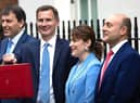 Finance Minister and MP for Louth and Horncastle Victoria Atkins (second right) with Chancellor James Hunt (centre) ahead of today's Budget..