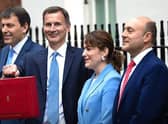Finance Minister and MP for Louth and Horncastle Victoria Atkins (second right) with Chancellor James Hunt (centre) ahead of today's Budget..