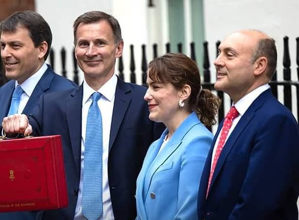 Finance Minister and MP for Louth and Horncastle Victoria Atkins (second right) with Chancellor James Hunt (centre) ahead of today's Budget..
