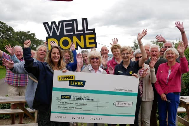 Members of LIVES with Bett for the cheque presentation event!