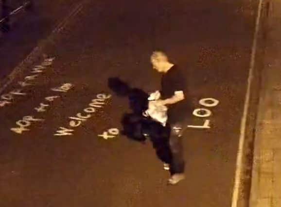 An image of the man police want to interview in connection with the Mercer Row graffiti.