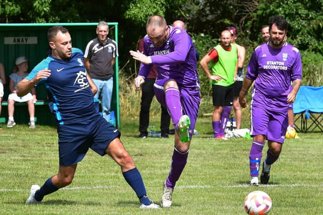 Action from the memorial football match.