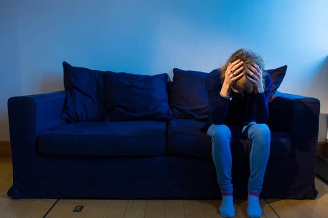 PICTURE POSED BY MODEL A woman showing signs of depression.