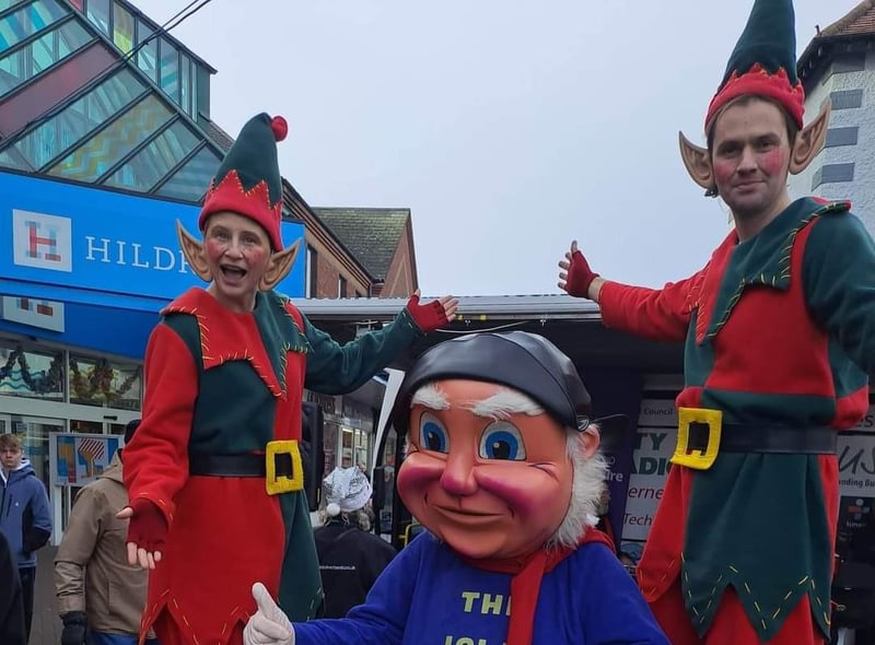 The Jolly Fisherman with stilt walkers at Skegness Christmas Market.
