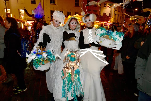 This trio showed off their their creative costumes and lanterns in the parade.