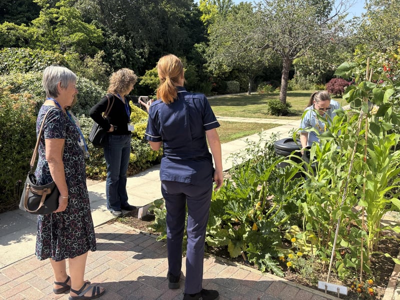 Admiring the gardens of the hospice.