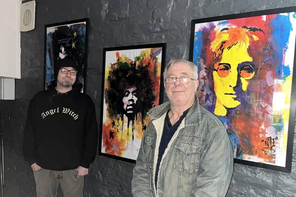 Artist Alfred Natcho (left) with Ross Ellis of Old Nick's Tavern.