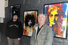 Artist Alfred Natcho (left) with Ross Ellis of Old Nick's Tavern.