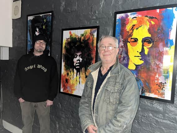 Artist Alfred Natcho (left) with Ross Ellis of Old Nick's Tavern.