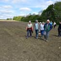 Anwick residents walking along a footpath through the field where the digester is planned. Photo: David Dawson