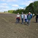 Anwick residents walking along a footpath through the field where the digester is planned. Photo: David Dawson