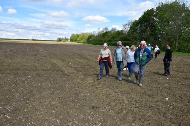 Anwick residents walking along a footpath through the field where the digester is planned. Photo: David Dawson