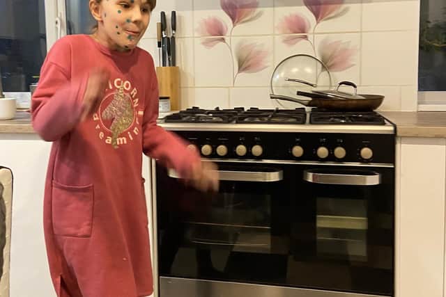 Lilia pictured in her kitchen.