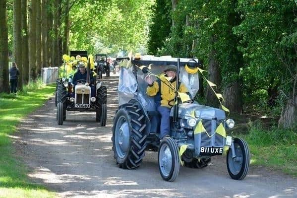 Making its way through picturesque countryside lanes is last year's Wolds Tractor Run.