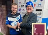 Richard Crunkhorn presents the Man of the Match award to Fraser Bayliss on behalf of sponsor Merrimans Lounge and Restaurant.