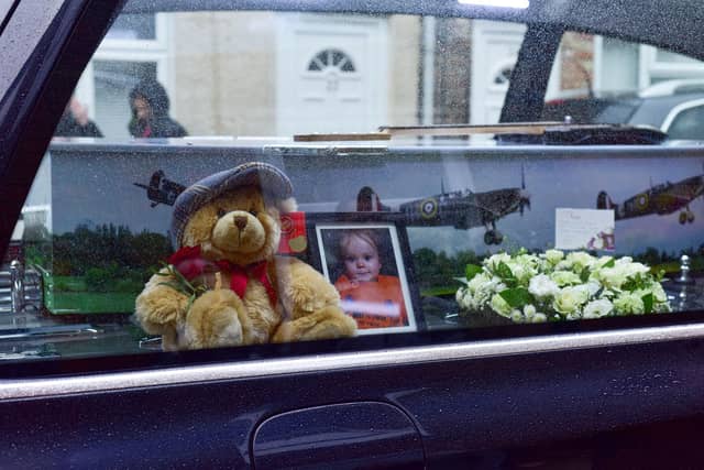 Adi's coffin features colourful images of Spitfire aircraft.