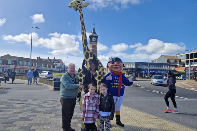 Mayor of Skegness Coun Pete Barry (left) with  Sebastian Mayer and his life-size giraffe puppet Zarafa, the Jolly Fisherman and Skegness Carnival Princess Rosie Cawley, 7, and Ella Mae Davis, 8.
