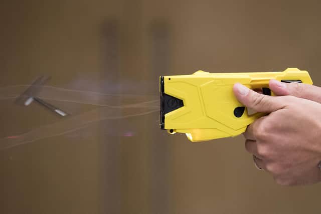 Police Sgt Ivan Merc from the West Midlands Fire Arms Unit demonstrates how to use the new X2 taser which is being rolled out in the West Midlands to replace the current X26 model.
