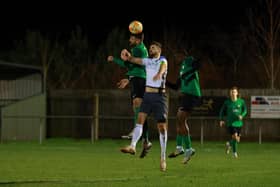 Tom Ward goes up for a header against Sherwood. Photo: Steve W Davies Photography.