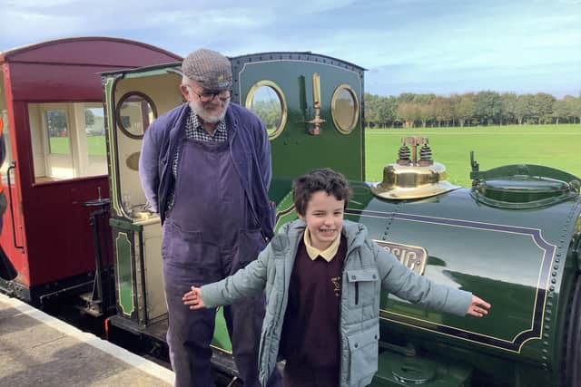 Volunteer driver and fireman Dave Enefer and Jurassic with one very happy pupil clearly enamoured of steam trains! Photo: Richmond School, Skegness.