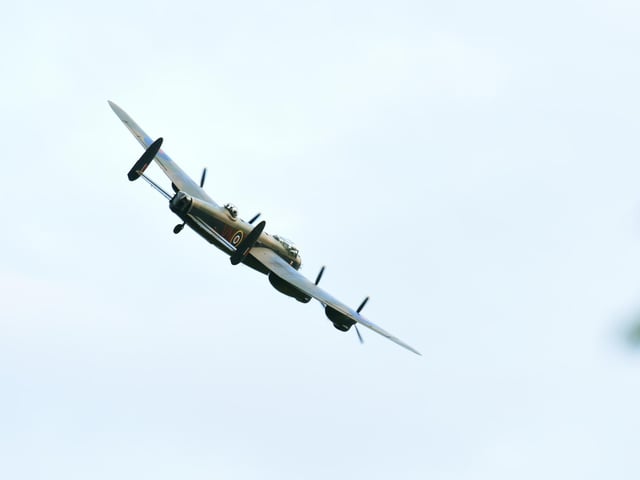 The Lancaster banking towards East Kirkby Aviation Centre after flying over RAF Spilsby.