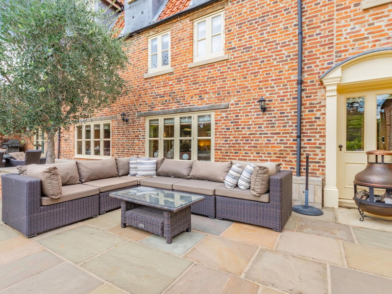 A terraced area to the rear of the home.