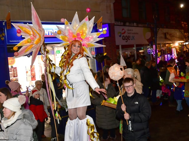 A stilt walker in the Illuminate Parade.