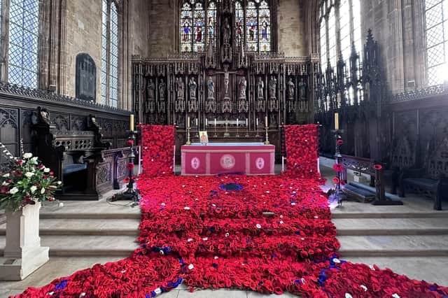 Members of the community helped to crochet and knit the poppies.